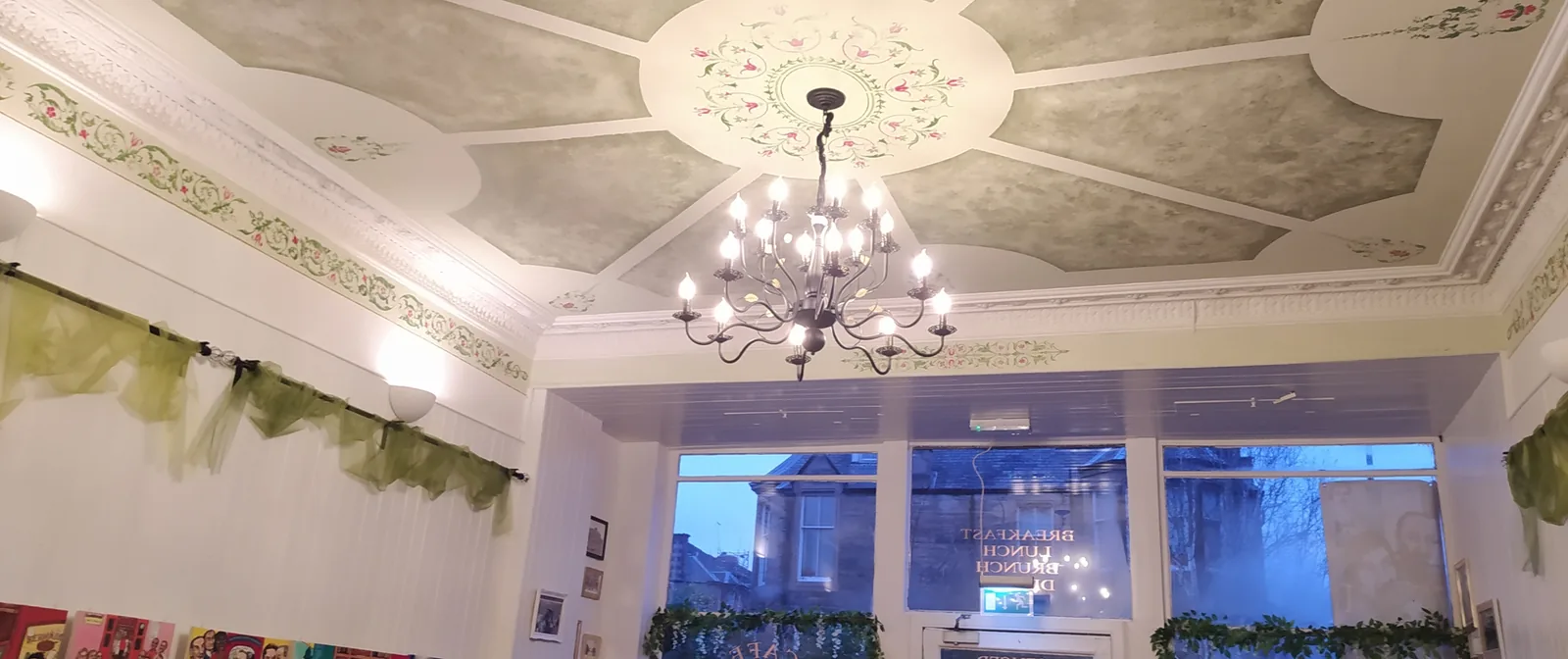 The painted ceiling and chandelier