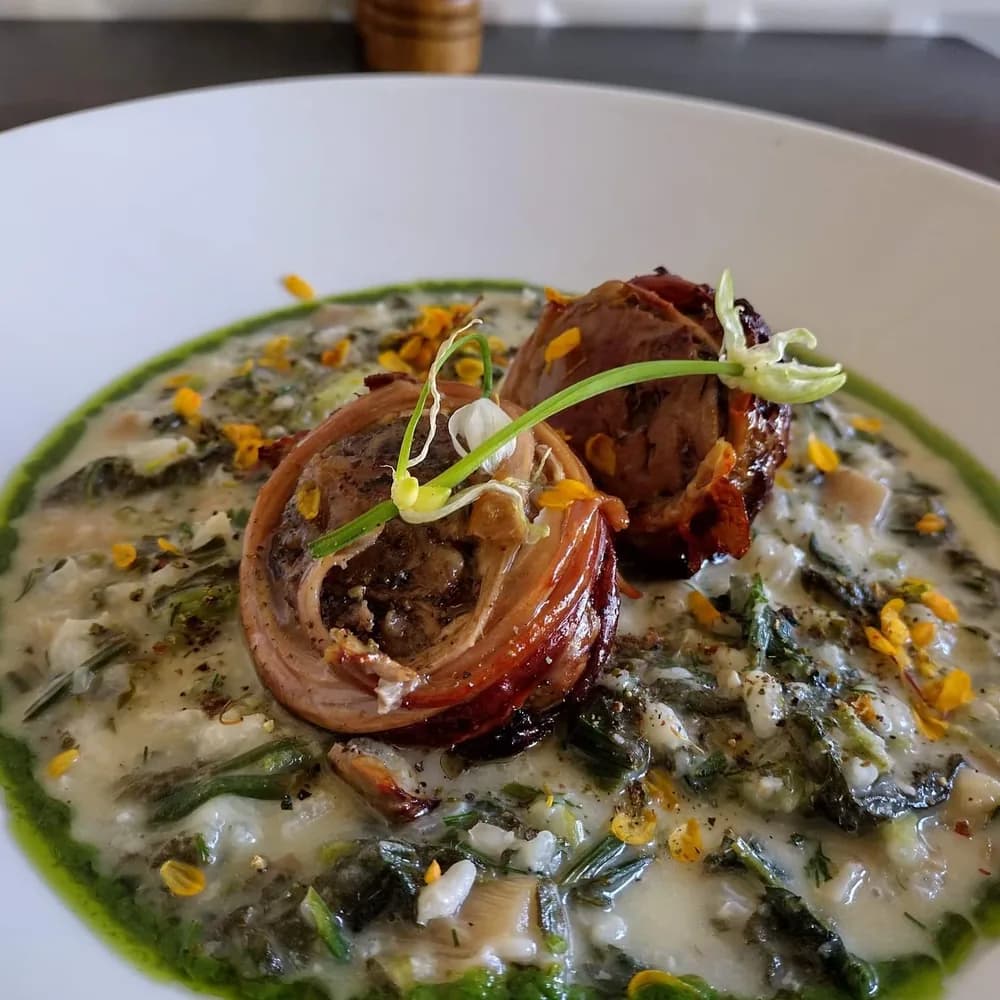 Kokoretsi plated with greens